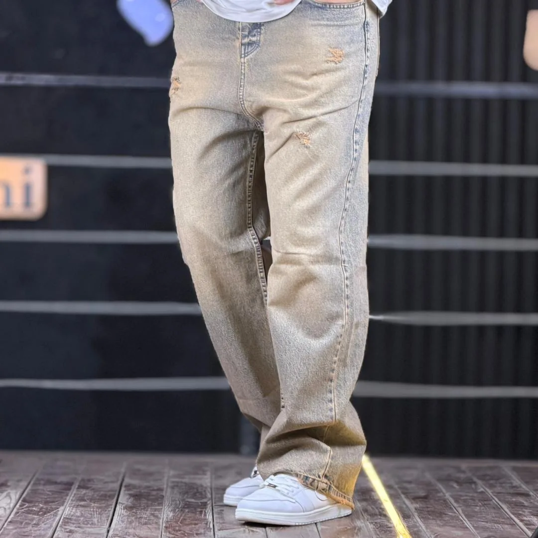 WhatsApp Image 2025-12-02 at 6.36.21 PM (2) شلوار جین بگ زخمی آبی تینت قهوه ای 4/464